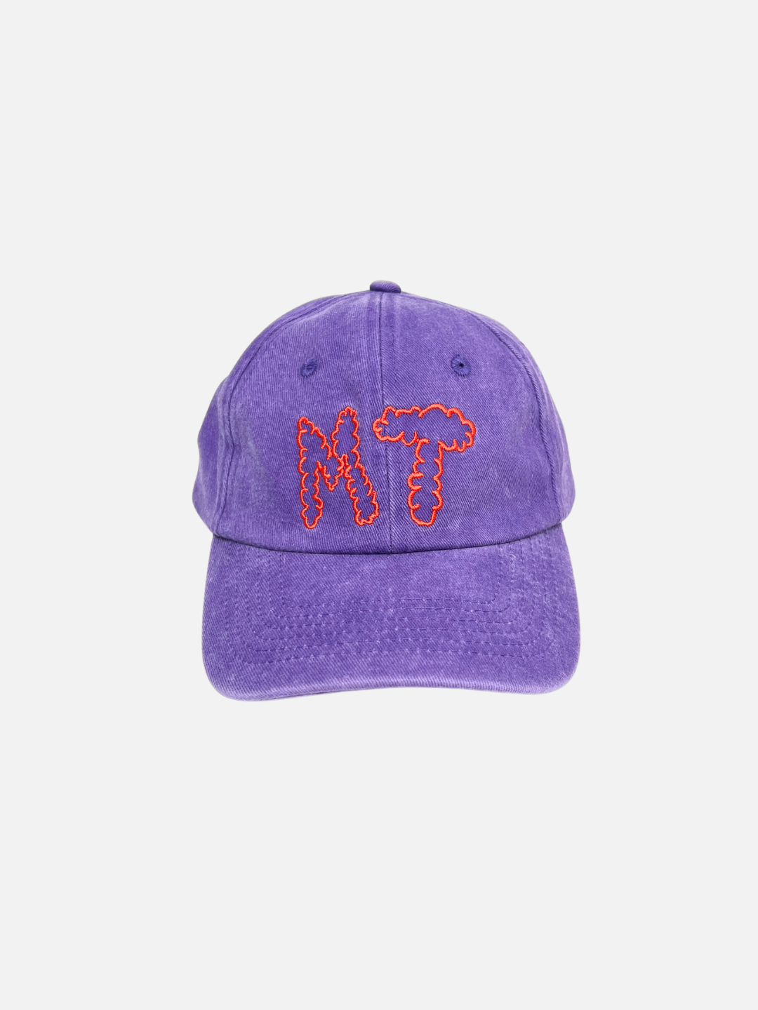 The MT DAD CAP is a purple cotton canvas baseball cap featuring "MT"—short for Milk Teeth—embroidered in red squiggly letters on the front.