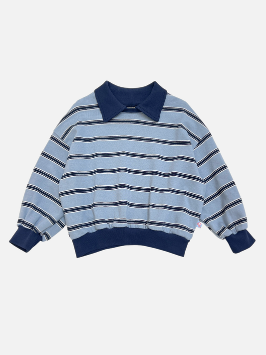 Image of The GARY COLLAR SWEATSHIRT, a blue and white horizontally striped long-sleeve pullover with navy collar, cuffs, and waistband, is shown laid flat on a white background.