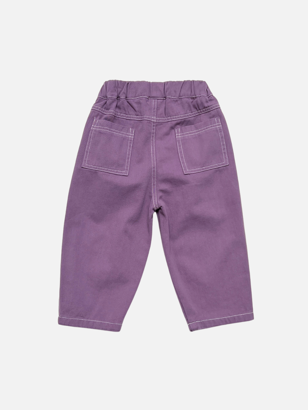 Purple | Kids baggy faded purple pants with contrast white topstitching on back patch pockets, shown flat on a light grey background.
