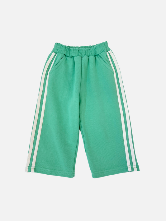 Image of The Minty Stripe Track Pants from Bon Bon Butik are green, made of cotton loop-back terry, and feature an elastic waistband with white side stripes on both legs.