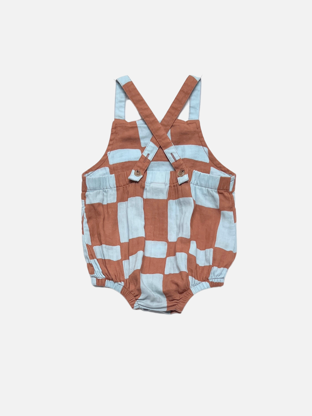Blue Checkers | Back view of blue and brown checkered romper on a white background, showing the straps crossed in back.
