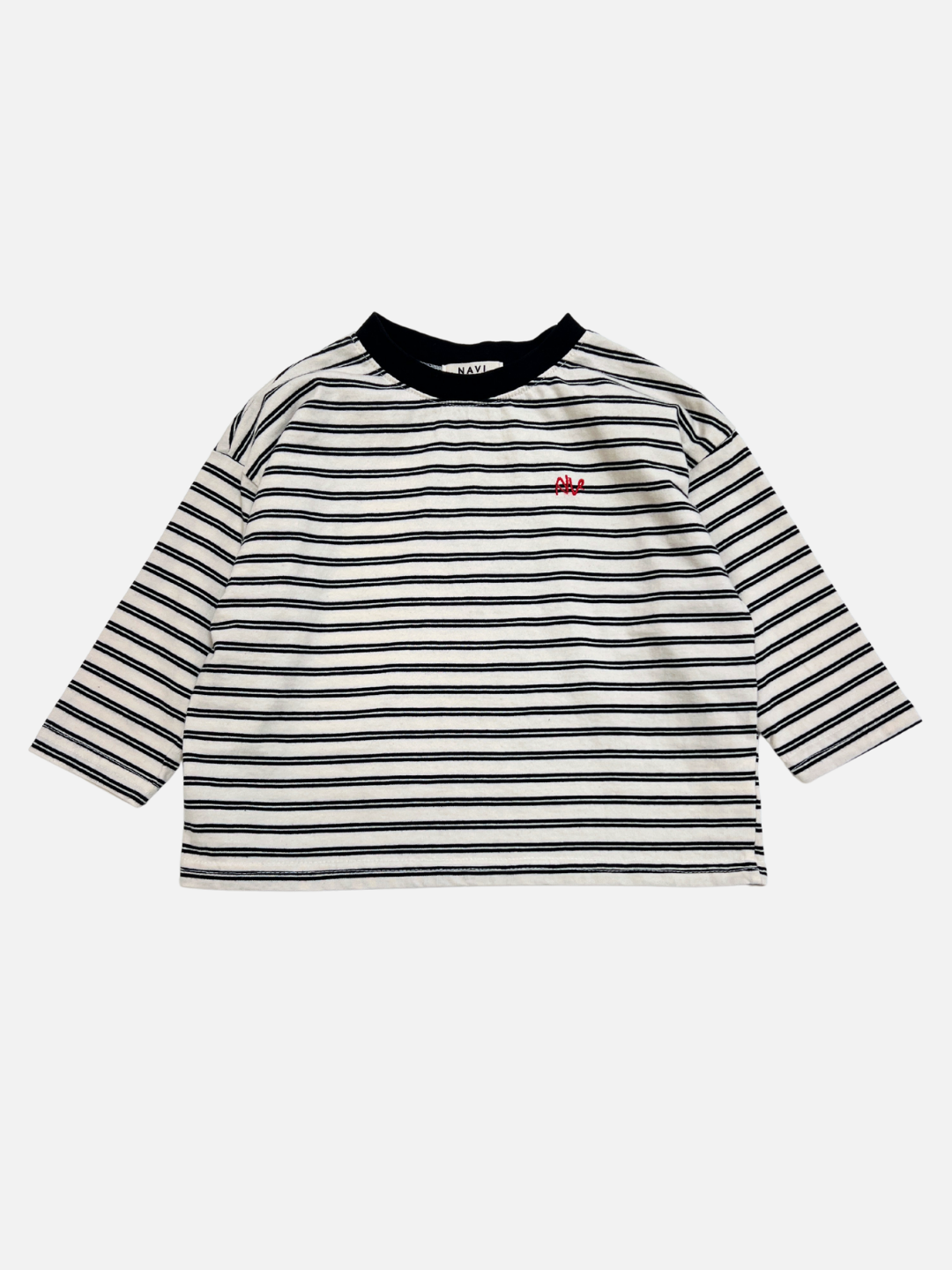 White | The CANOE LONGSLEEVE TEE in white features black and white stripes, a black collar, and a small red embroidered design on the left chest.