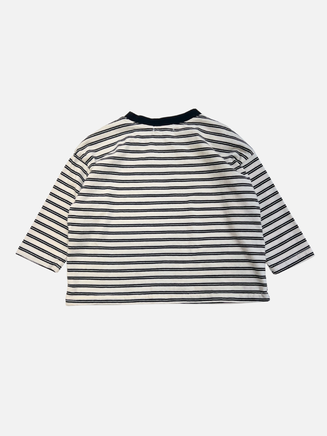 The CANOE LONGSLEEVE TEE features classic black and white horizontal stripes and is shown laid flat with the back facing up.