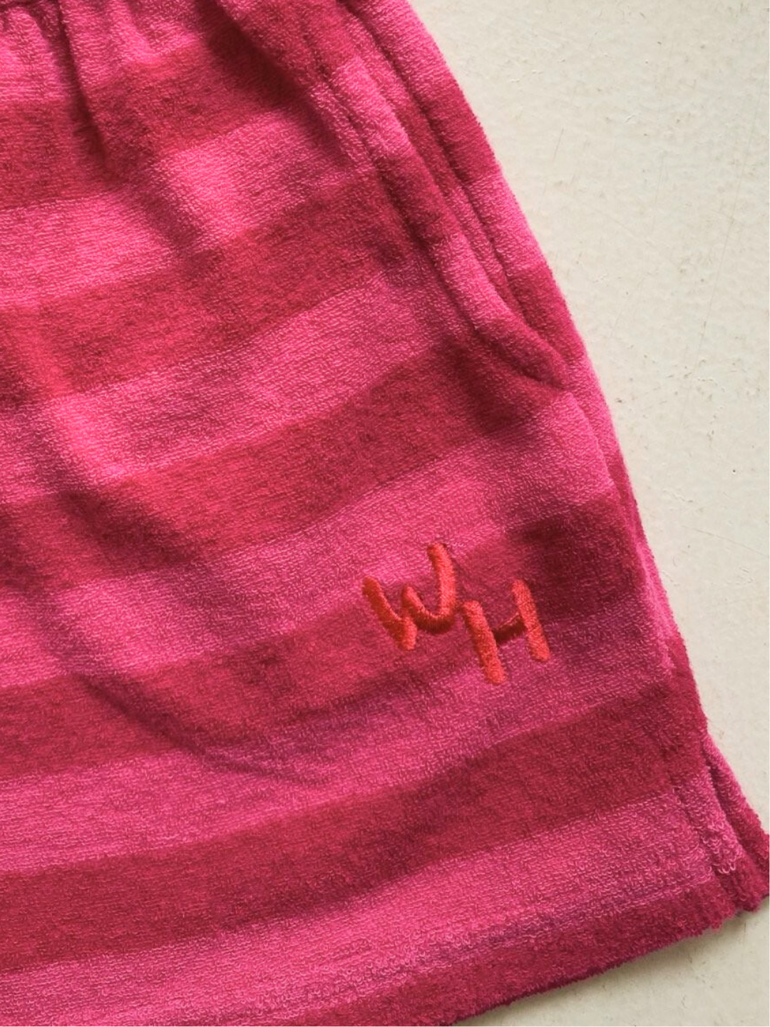WH embroidered logo on red/pink Riviera shorts