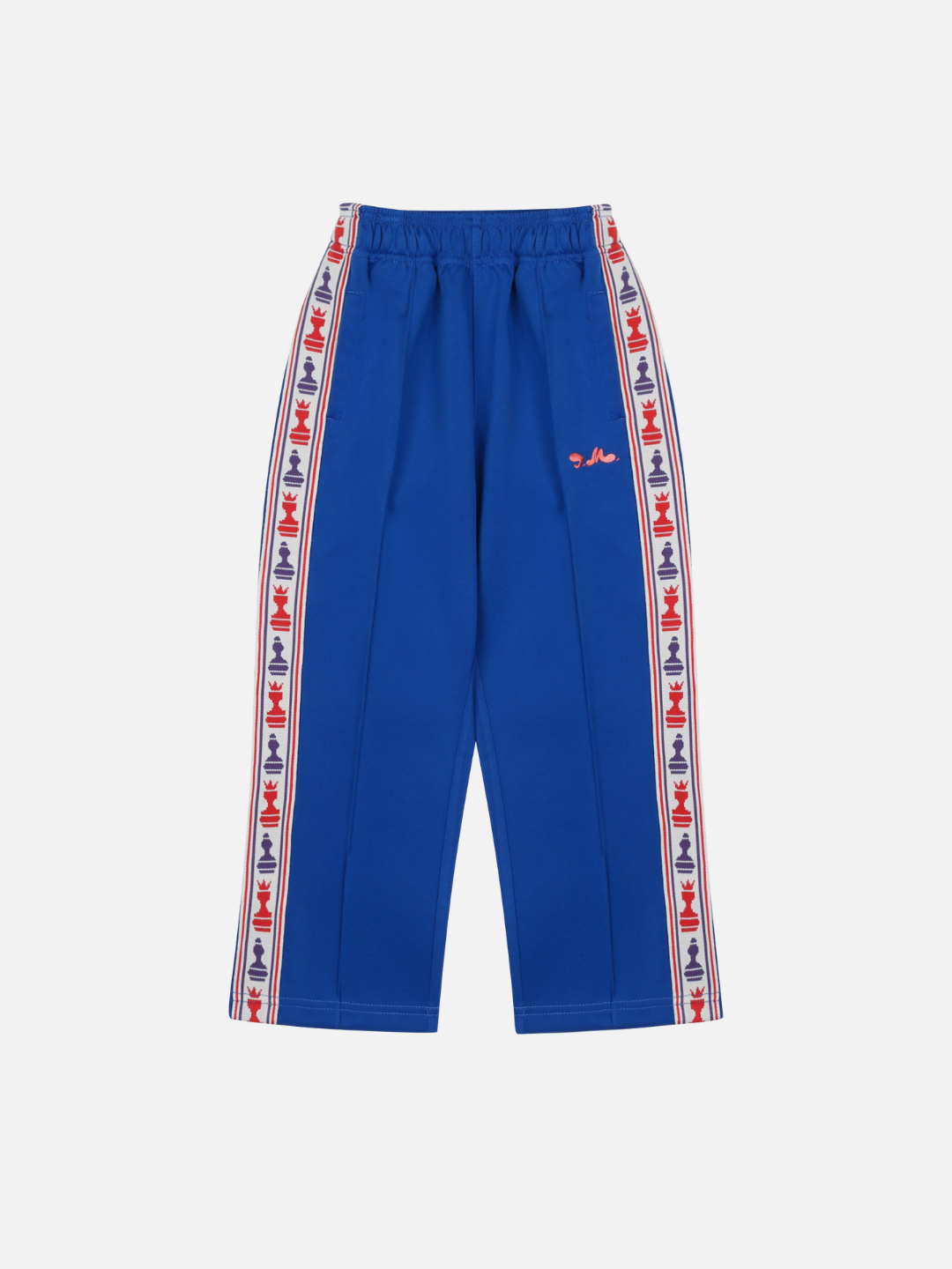 The CHESS TRACK PANTS in blue feature an elastic waistband, red, white, and blue logo tape along the side seams, and a small red logo on the left thigh; laid flat on a white background for a comfortable and stylish look.