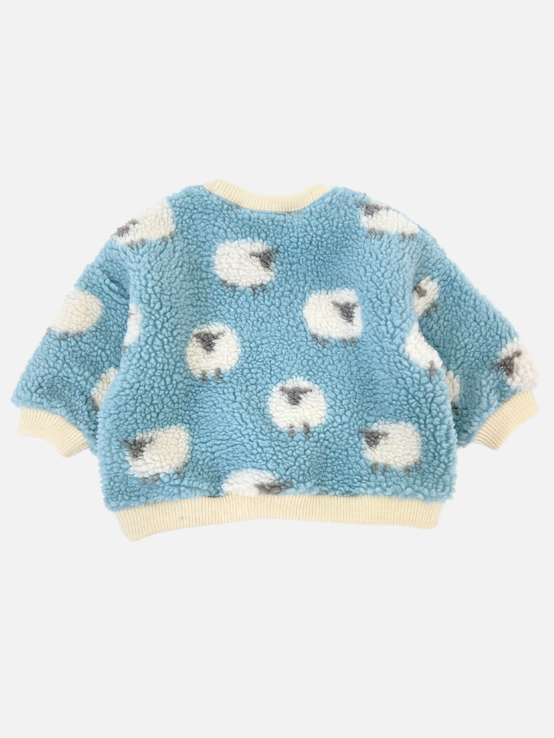 This delightful Korean baby brand offers the SHEEP BABY SWEATSHIRT, a blue fleece jacket with fluffy sheep patterns and finished with beige cuffs and collar.