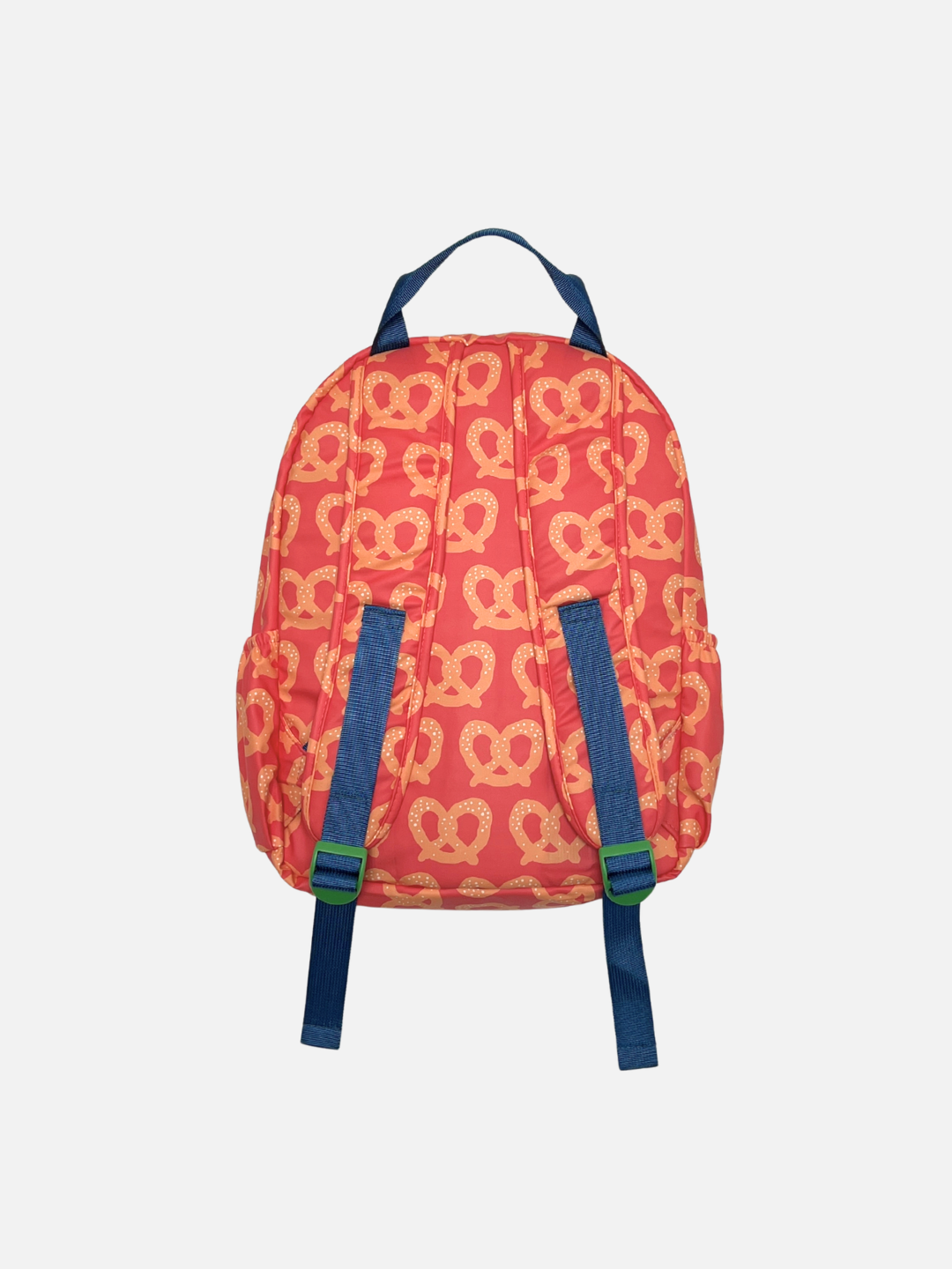 Red Pretzel | A red backpack with a repeating yellow pretzel pattern and navy blue straps with green buckles, shown from the back against a light gray background.