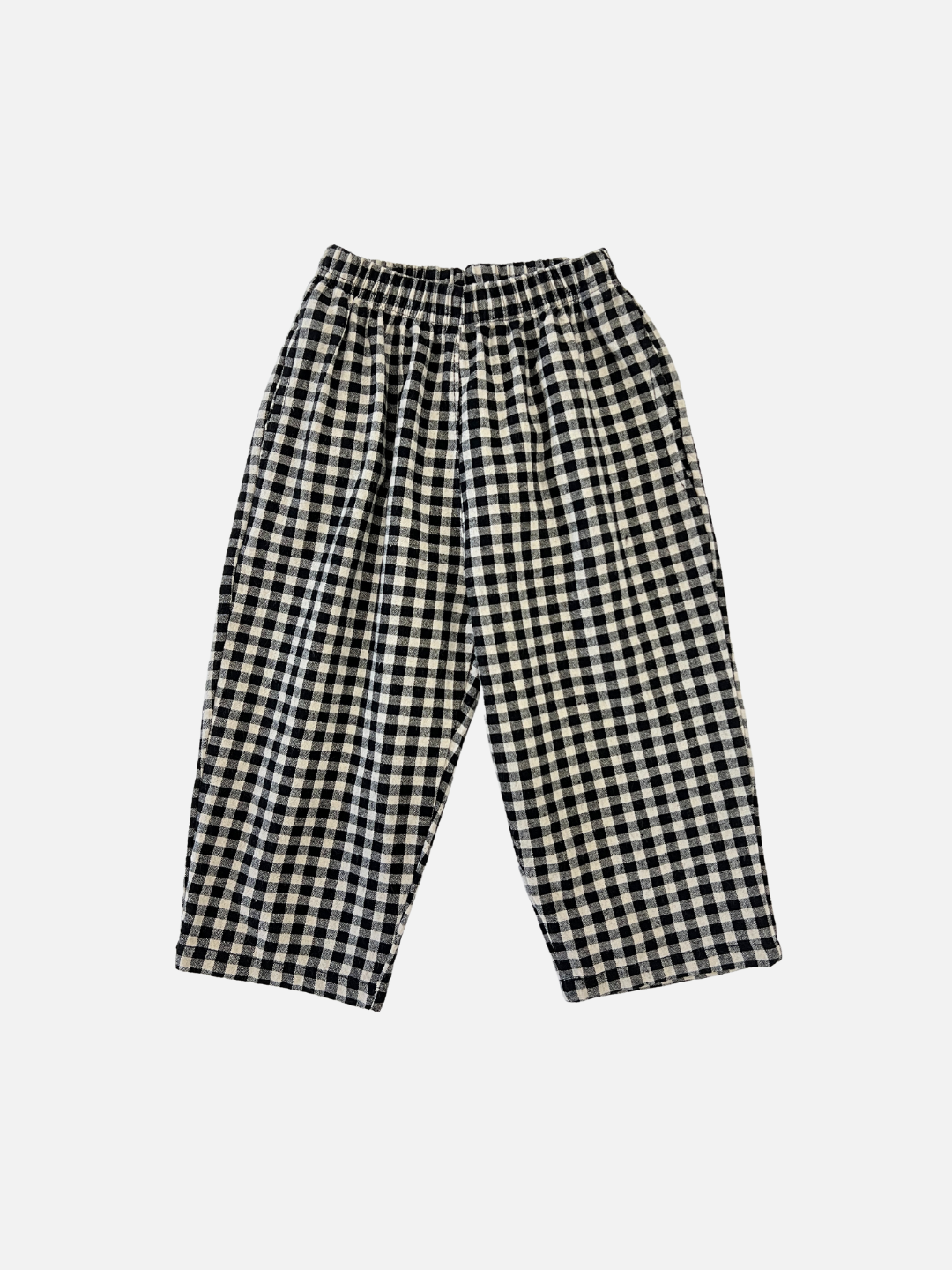 Front view of kids black and off-white gingham check pants.
