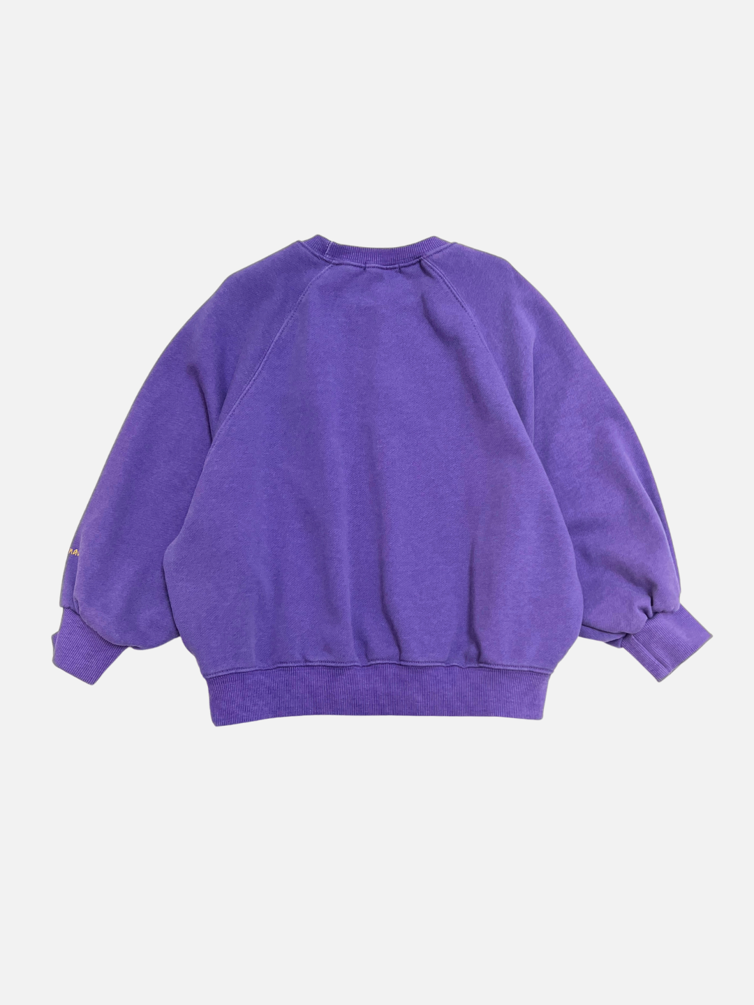 Purple | The PLAYTIME SWEATSHIRT, a plain purple Korean kids sweatshirt made of garment-dyed cotton, is laid flat with the back side facing up on a white background.