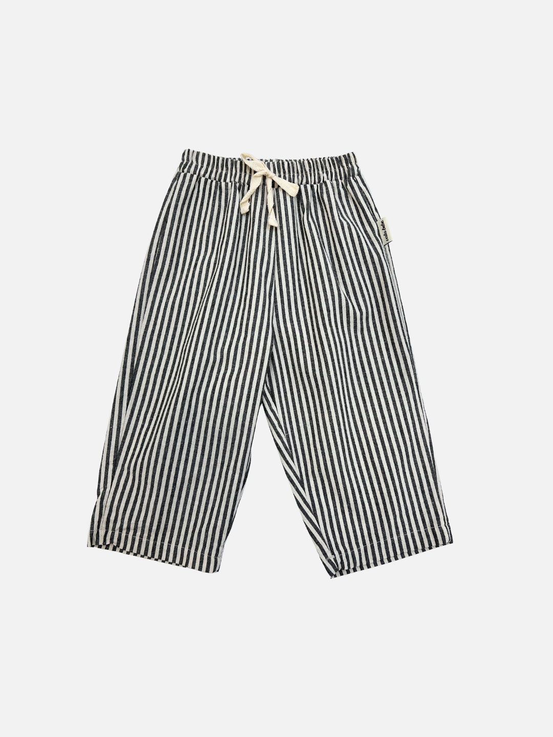 COCO STRIPE BABY PANTS in charcoal, featuring black and white vertical stripes, an elastic waistband, and adjustable drawstring tie, displayed flat on a white background.