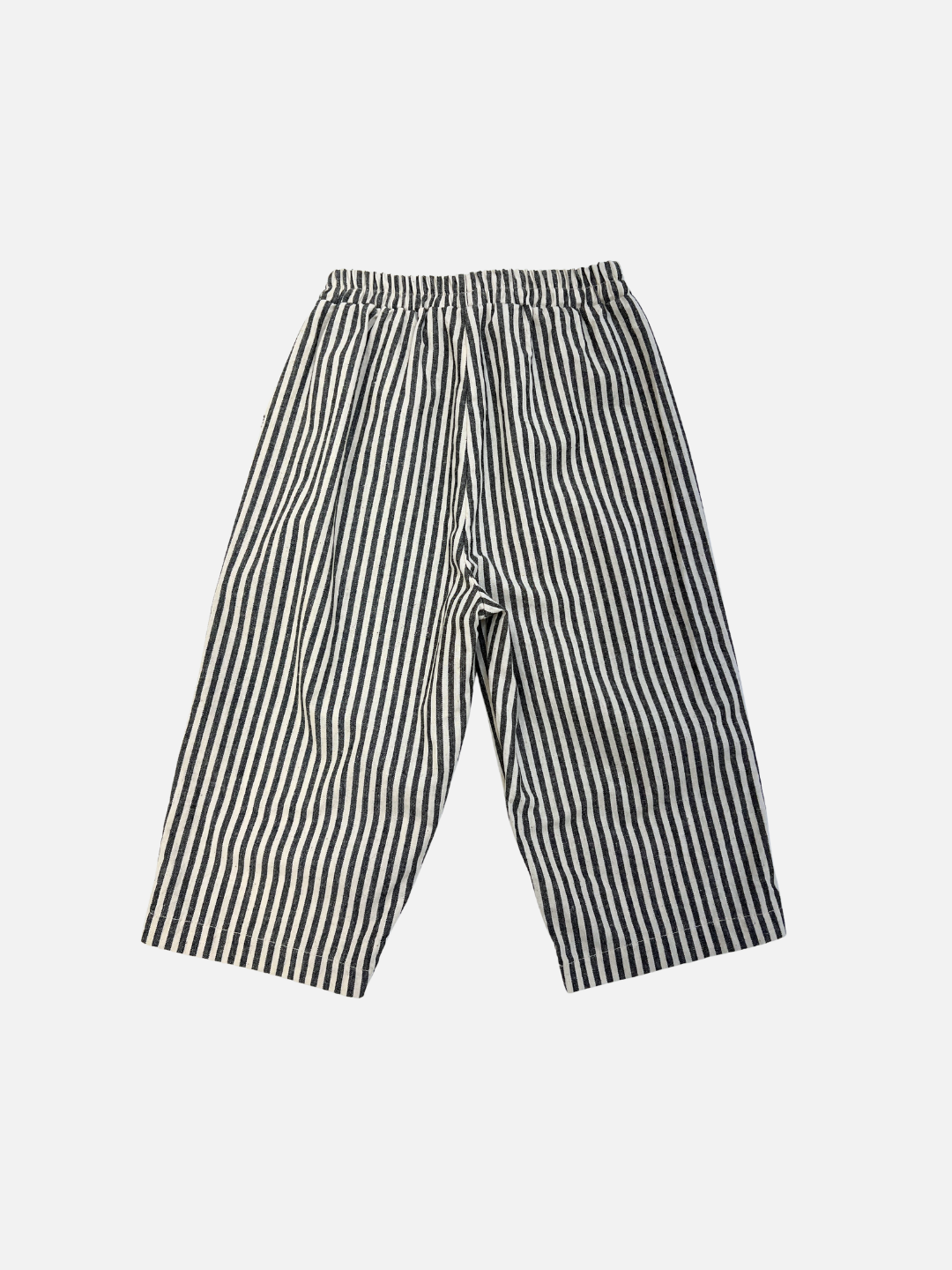 Charcoal | COCO STRIPE BABY PANTS: Loose-fitting pants with bold black and white vertical stripes and a comfy elastic waistband, shown on a white background.