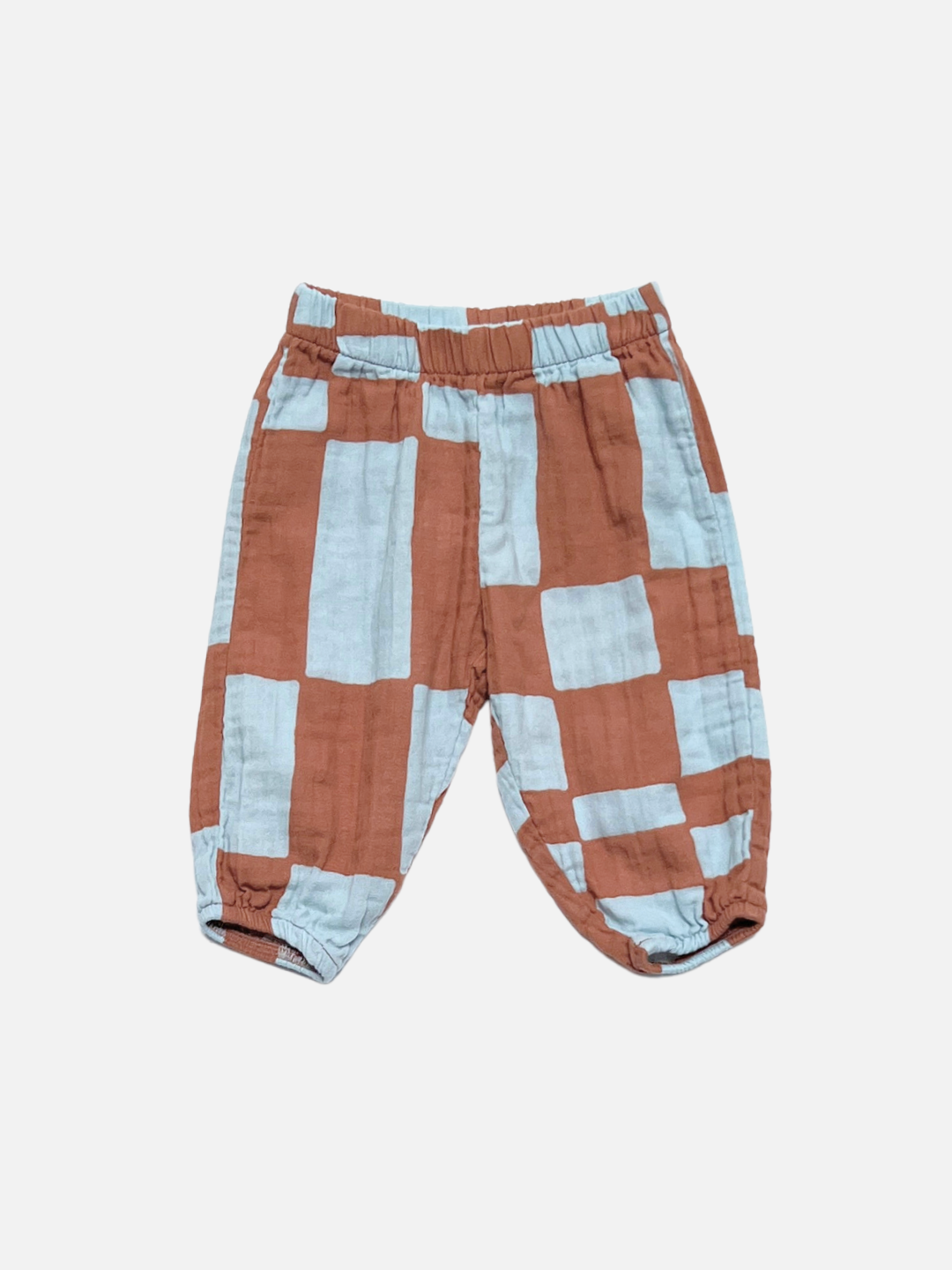 Blue Checkers | The MUSLIN PULL ON PANT in Blue Checkers features an elastic waistband and a geometric pattern on white organic cotton muslin—ideal toddler jogger pants for playtime or casual outings.
