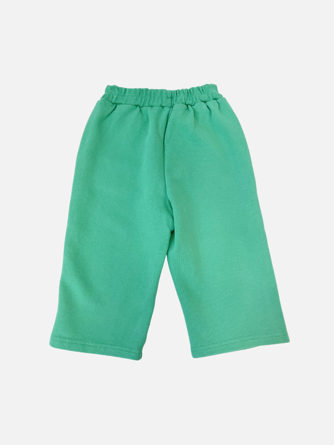 Bon Bon Butik's MINTY STRIPE TRACK PANTS for children feature an elastic waistband and are crafted from soft cotton loop-back terry. Displayed on a pristine white background, they seamlessly blend comfort and style.