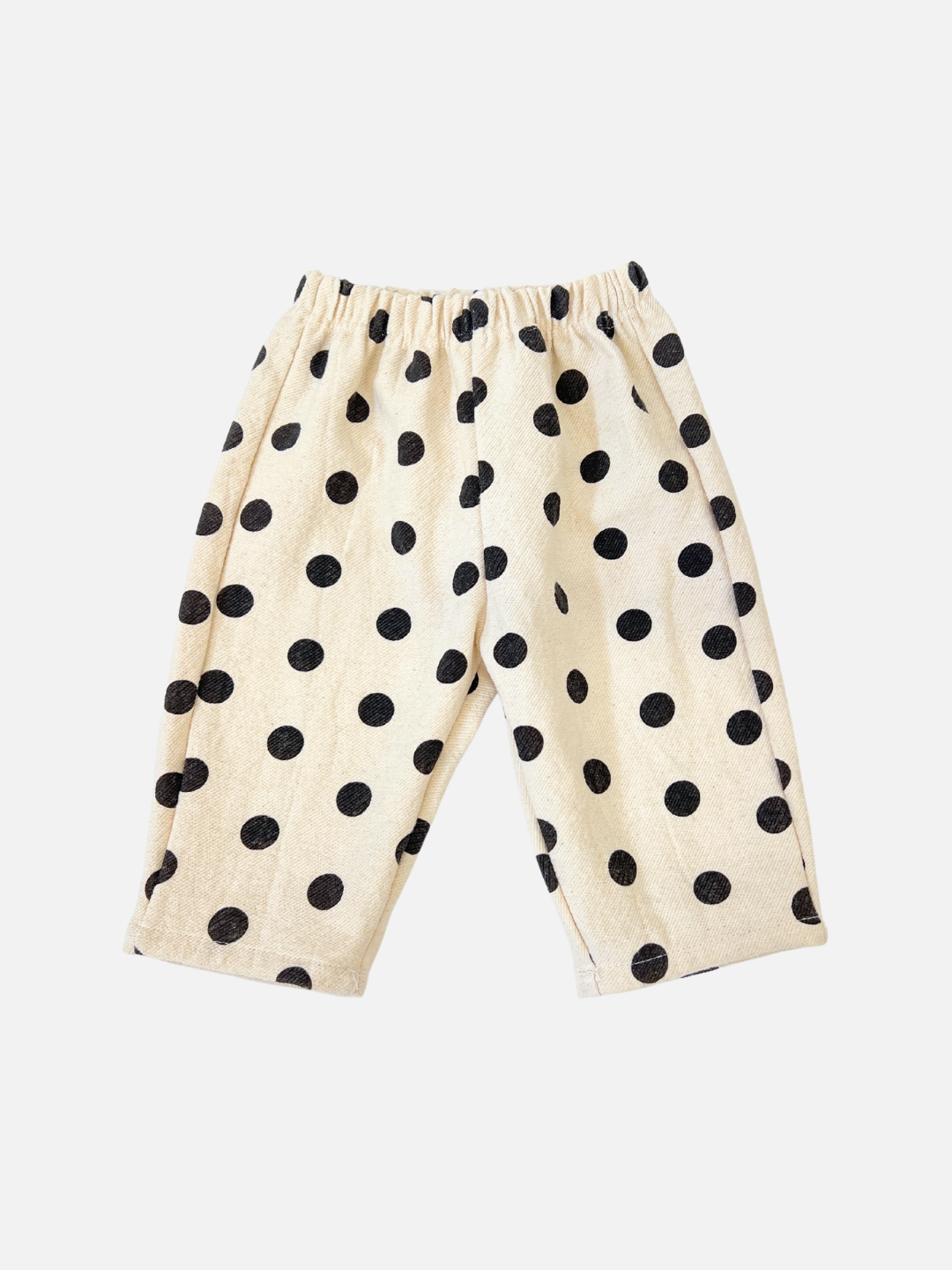 Ecru pull-on cotton pants with black polka dots, designed by a renowned Korean baby brand, POLKA DOT PANTS.