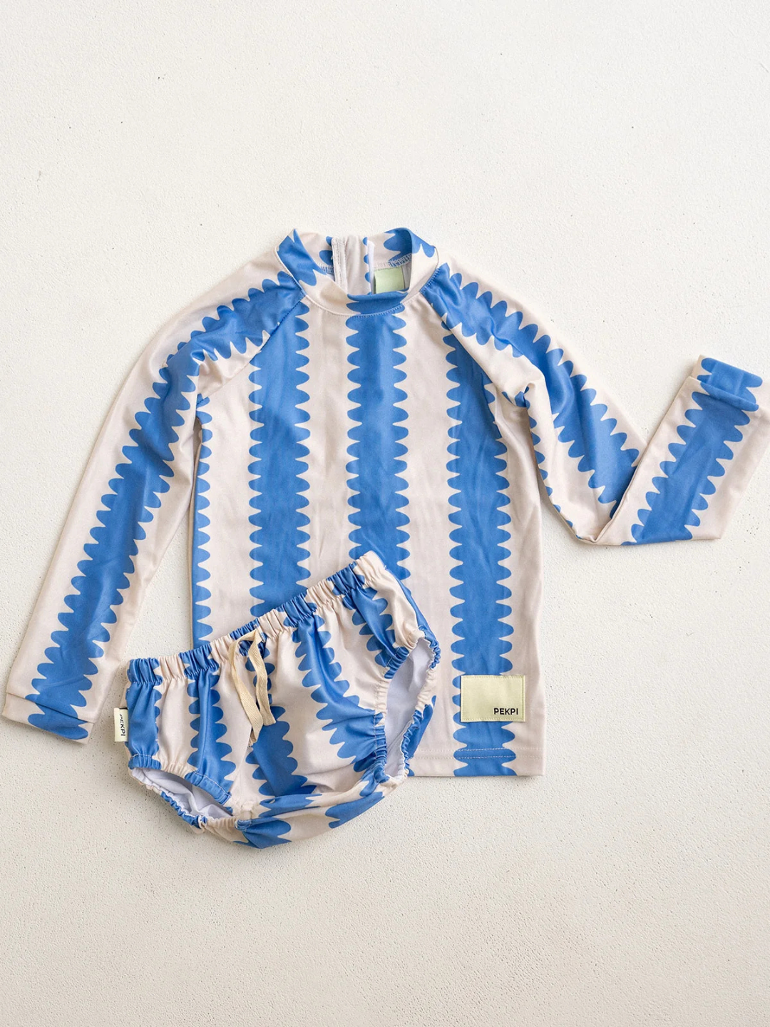 a swim diaper with a matching rash guard