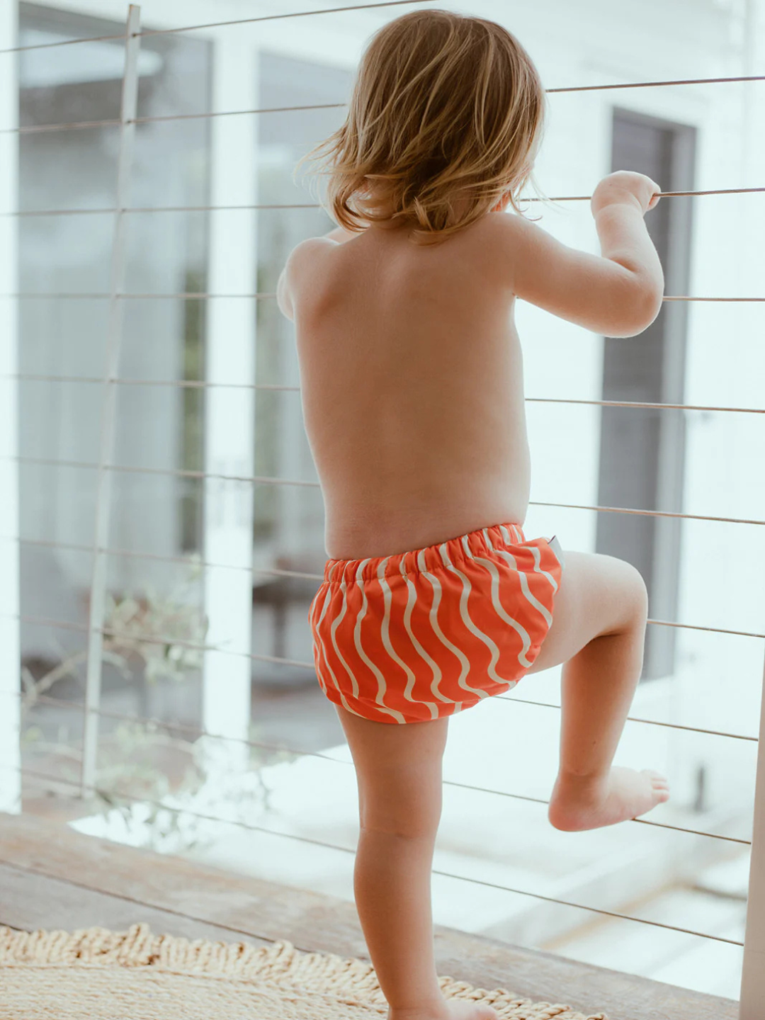 Spaghetti | a child is wearing a swim diaper