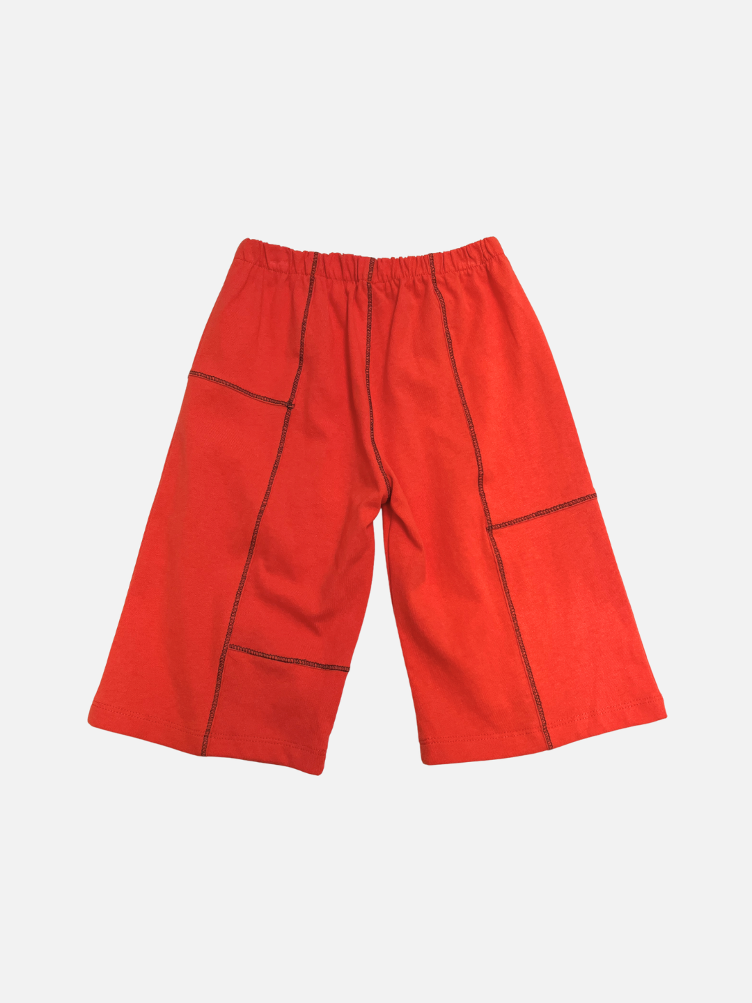Red | The TOPSTITCH BABY PANT features bright red wide-leg shorts with an elasticated waist and bold black stitching, ideal as sturdy crawling pants for active babies. Shown on a plain white background.