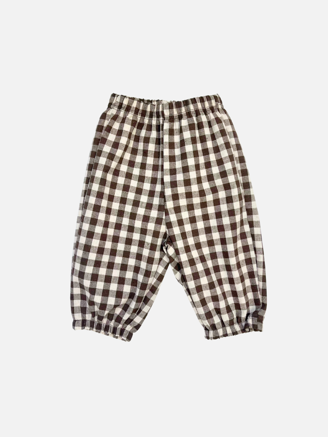 Aosta presents the BABY PULL-ON PANT, woven from cotton with an elastic waistband and cuffs, featuring a classic black and white gingham check pattern.