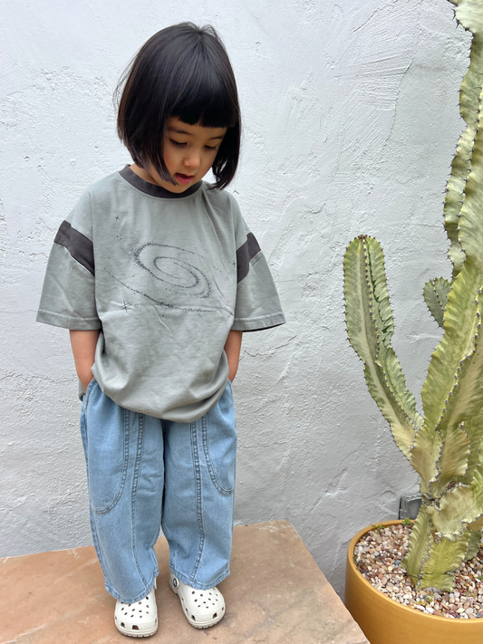 Second image of MIYU JEANS: Light blue baggy jeans made from lightweight denim with an elasticated waist and wide legs, shown flat on a white background.