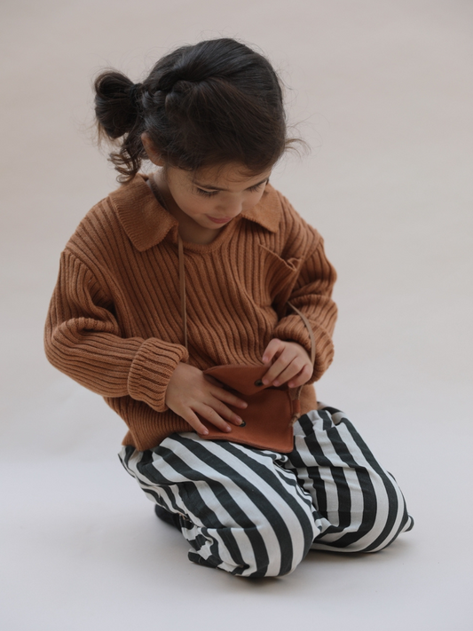 Second image of Black | Front view of the kid's striped pants in black stripe