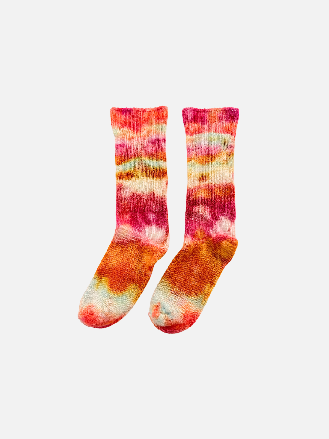 A pair of kids' ankle socks in dappled shades of orange and pink