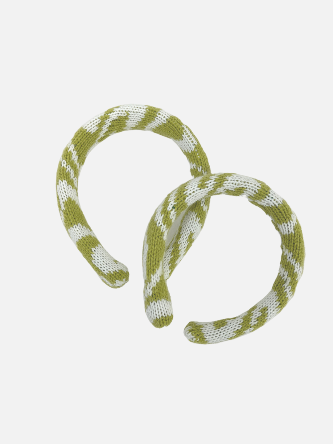 Two sizes of kids' knitted headband in swirls of pale green and white