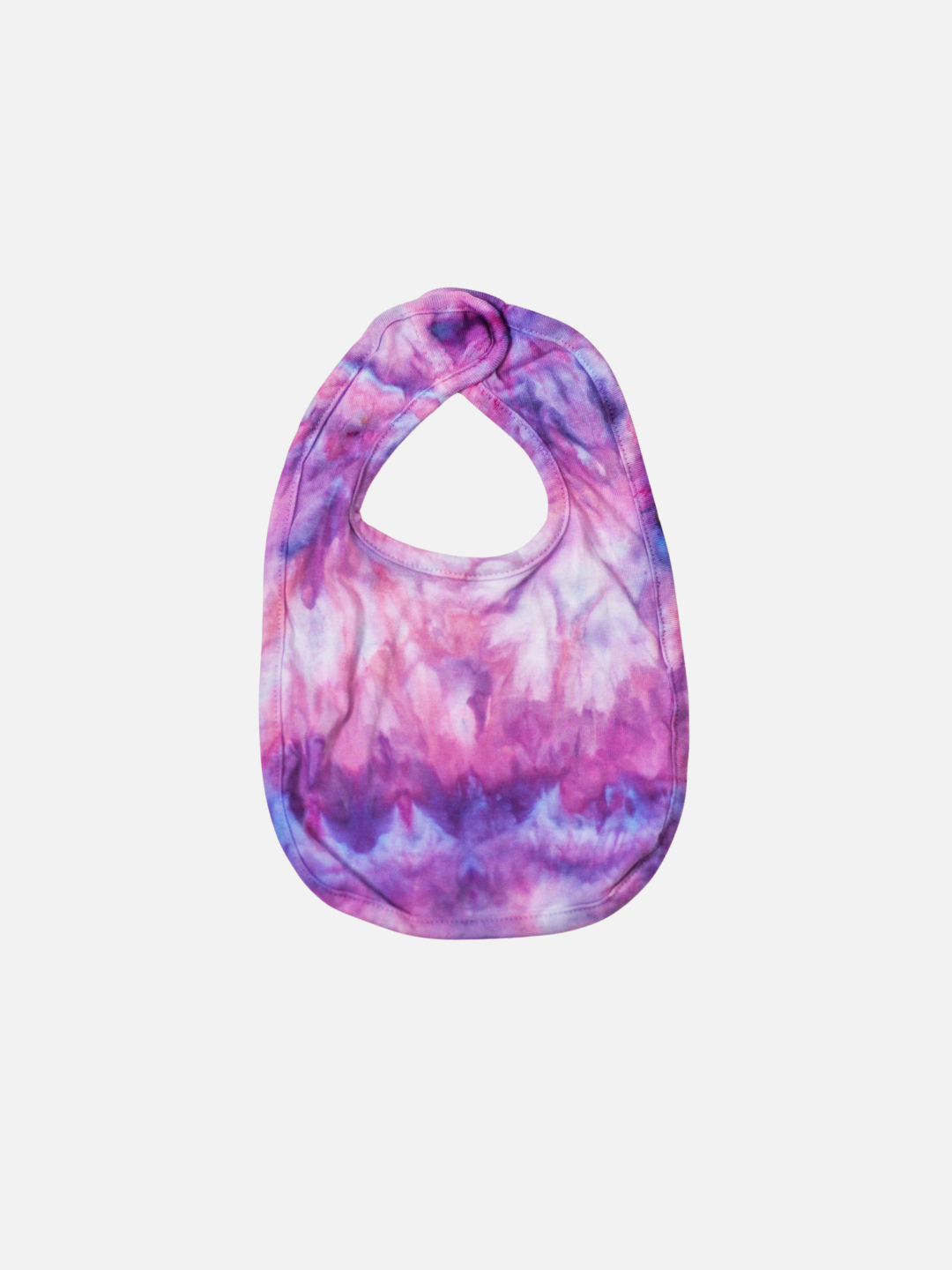 Ultraviolet | Check out the ICED-DYED BABY BIB in captivating ultraviolet hues. This handmade baby bib features a simple round neckline and soft fabric, making it a perfect addition to your collection of baby accessories.