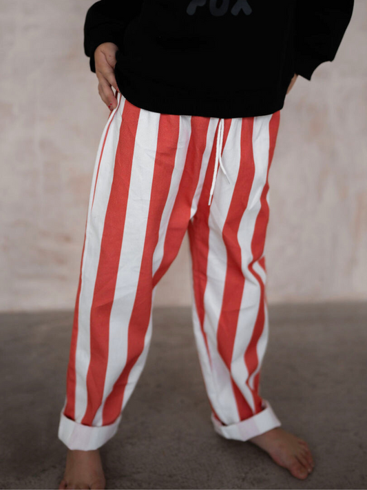 Second image of Check out our new arrivals: the RED BLOCK STRIPE PANT, featuring red and white vertical stripes with an elastic waistband and drawstring for your baby's ultimate comfort. Shop all clothing today!