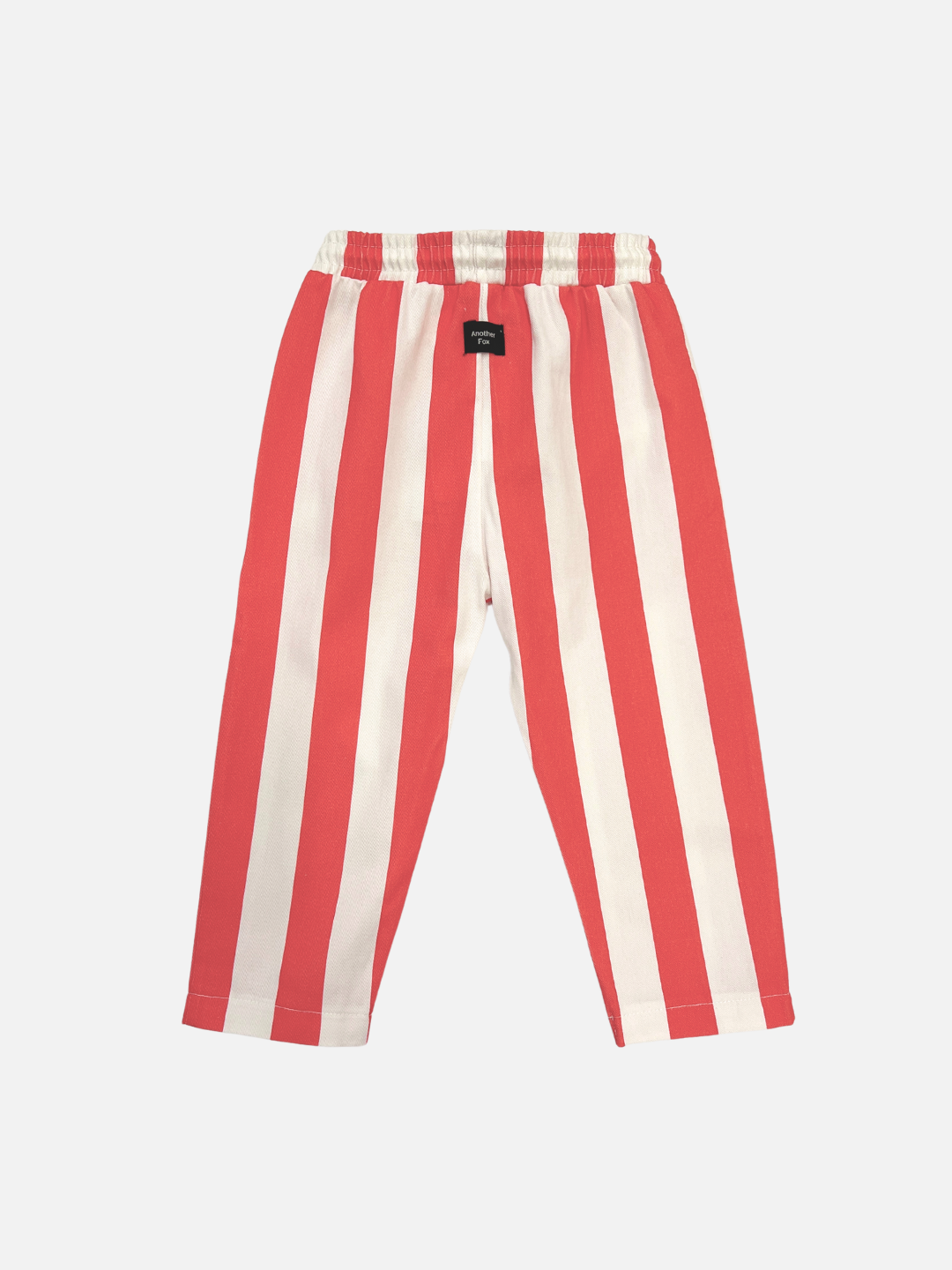 The Red Block Stripe Pant features red and white vertical stripes with an elastic waistband, making it perfect for your baby. Showcased against a white background, this stylish piece is available now. Shop all clothing today to discover new arrivals!