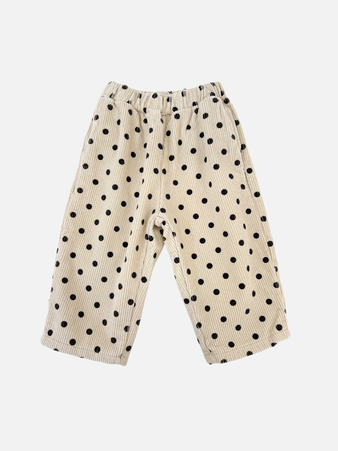 Ecru | Ecru children's pants with black polka dots, known as the FLEECE-LINED DOT CORDS, made from soft corduroy by a renowned Korean kids brand, featuring an elastic waistband, laid flat on a white background.