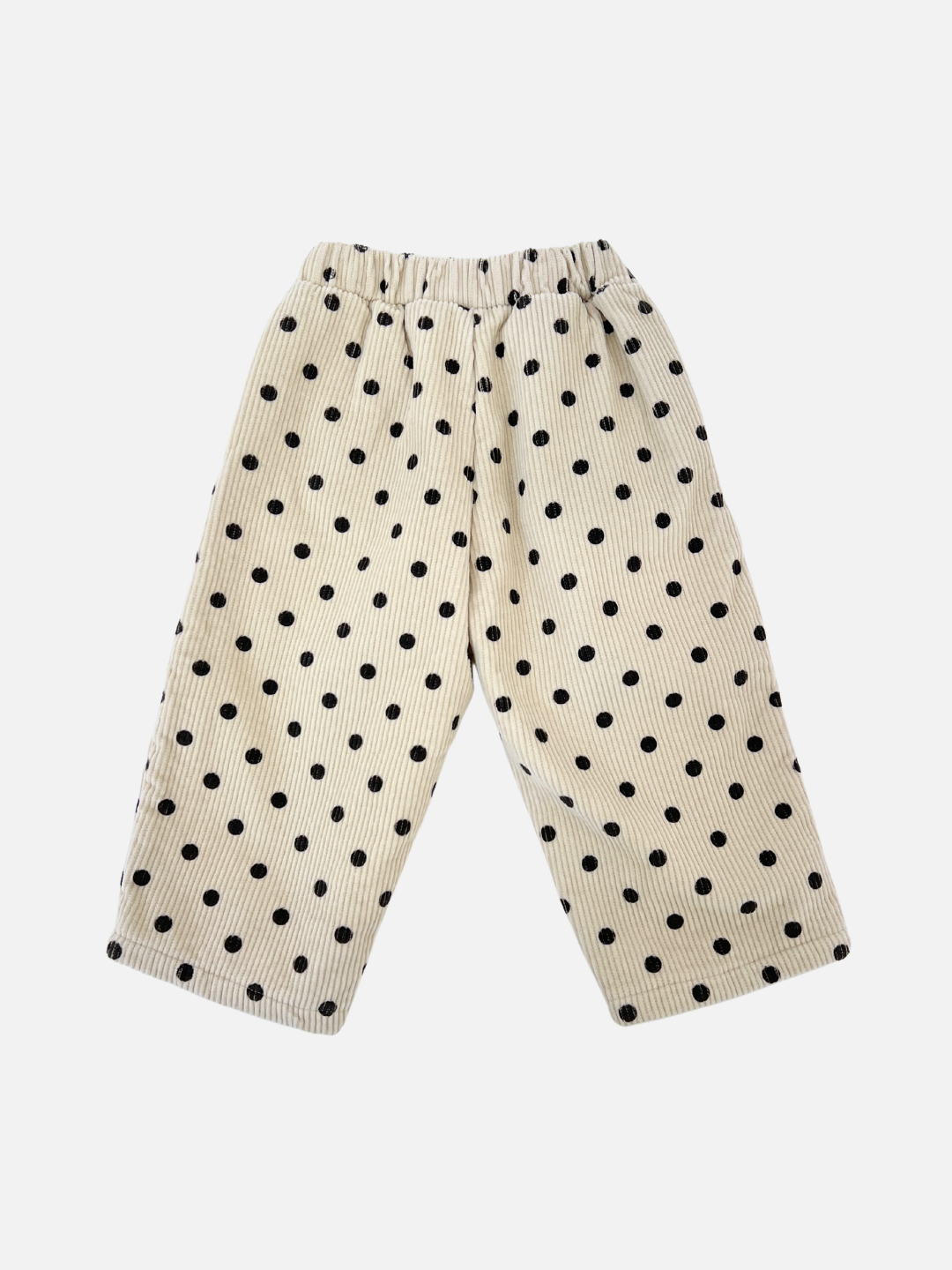 Ecru | Product Description: The FLEECE-LINED DOT CORDS are off-white corduroy pants adorned with black polka dots and narrow vertical stripes, featuring a comfortable elastic waistband. They are displayed on a plain white background.