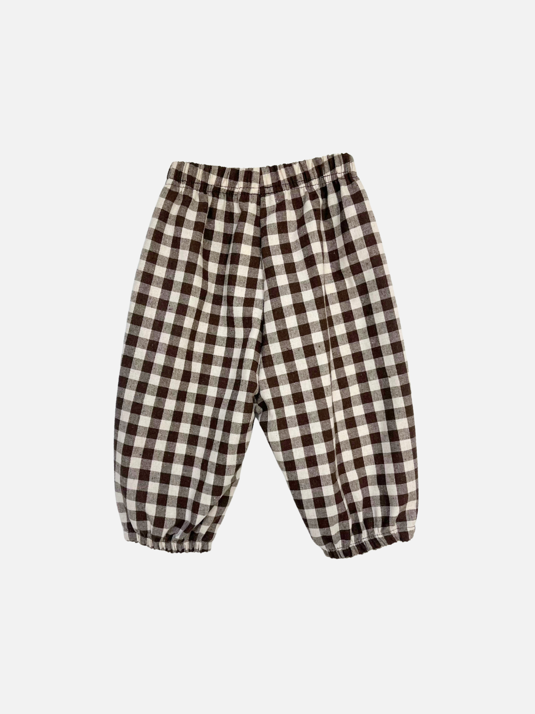 BABY PULL-ON PANT in Brown Check: woven cotton baby pants with elastic waistband and cuffs, featuring a brown and white check pattern. Displayed on a white background—a comfy piece from the Aosta baby clothing collection.