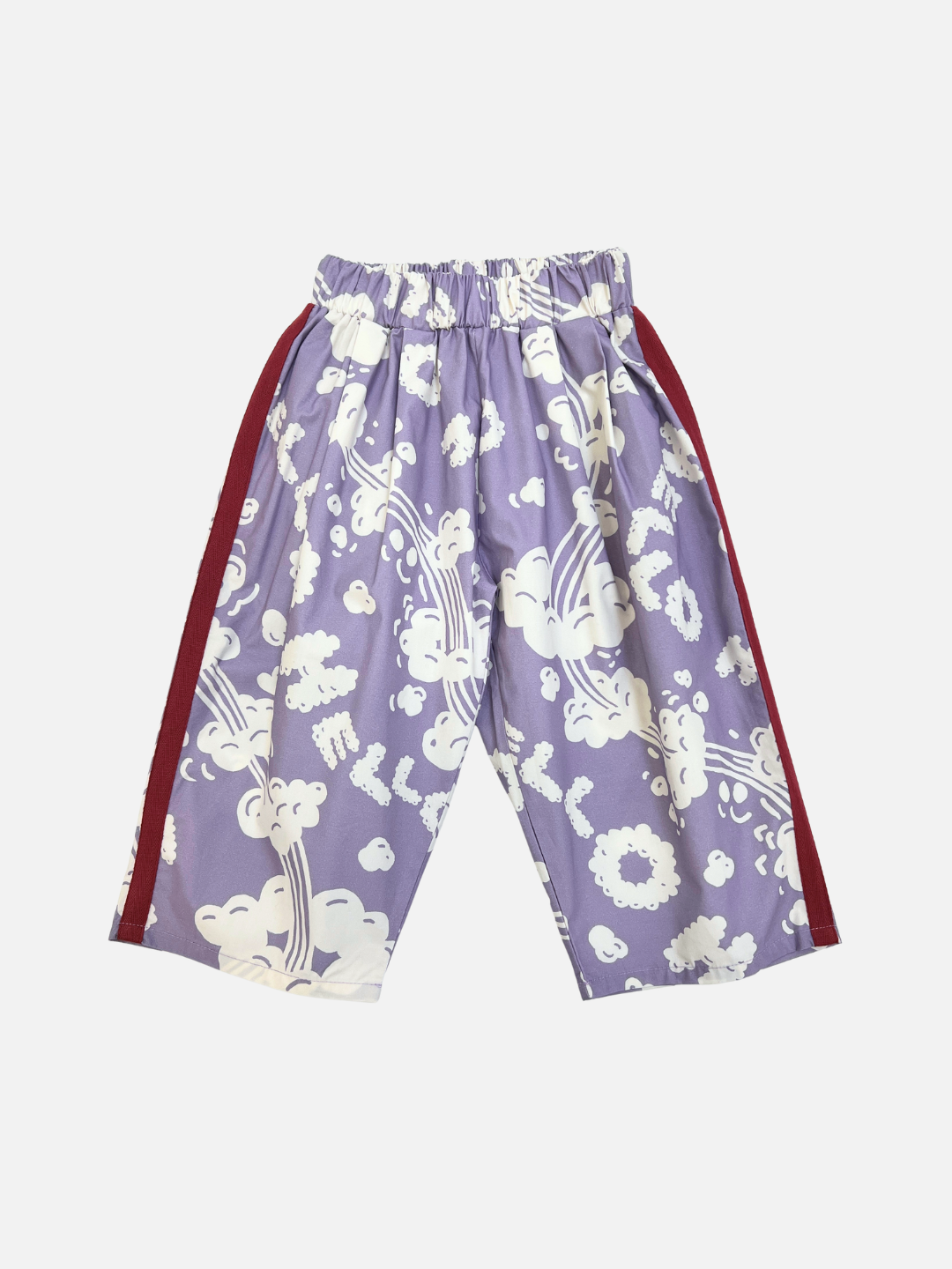 Purple | The SKYWRITING PANT features a purple color with a white cloud pattern, elastic waistband, and red side stripes, shown laid flat on a white background.