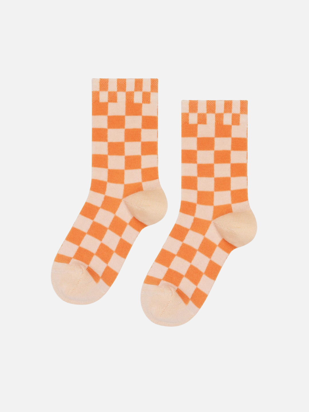 A pair of kids' ankle socks in a peaches and cream check