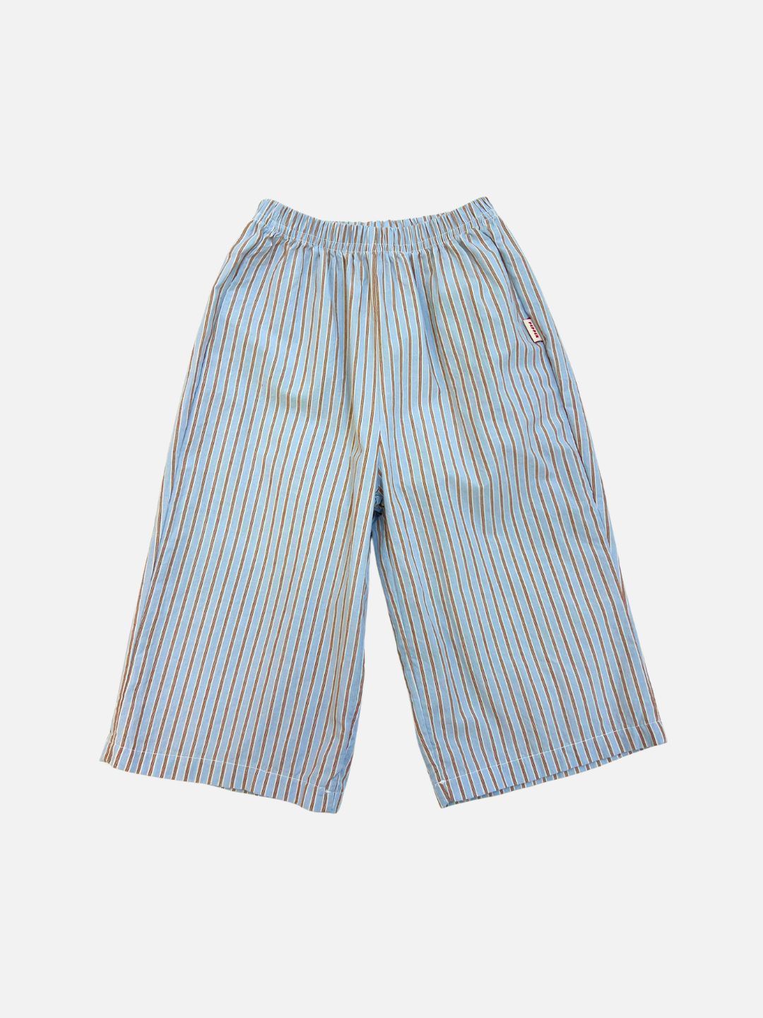 Blue | The POPLIN STRIPE PANT in blue features vertical orange and white stripes and a comfortable elastic waistband, shown on a plain white background.
