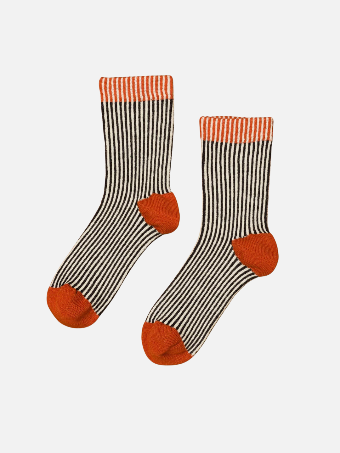 A pair of kids' ankle socks in black and cream stripes, with orange and cream tops and solid orange toes and heels