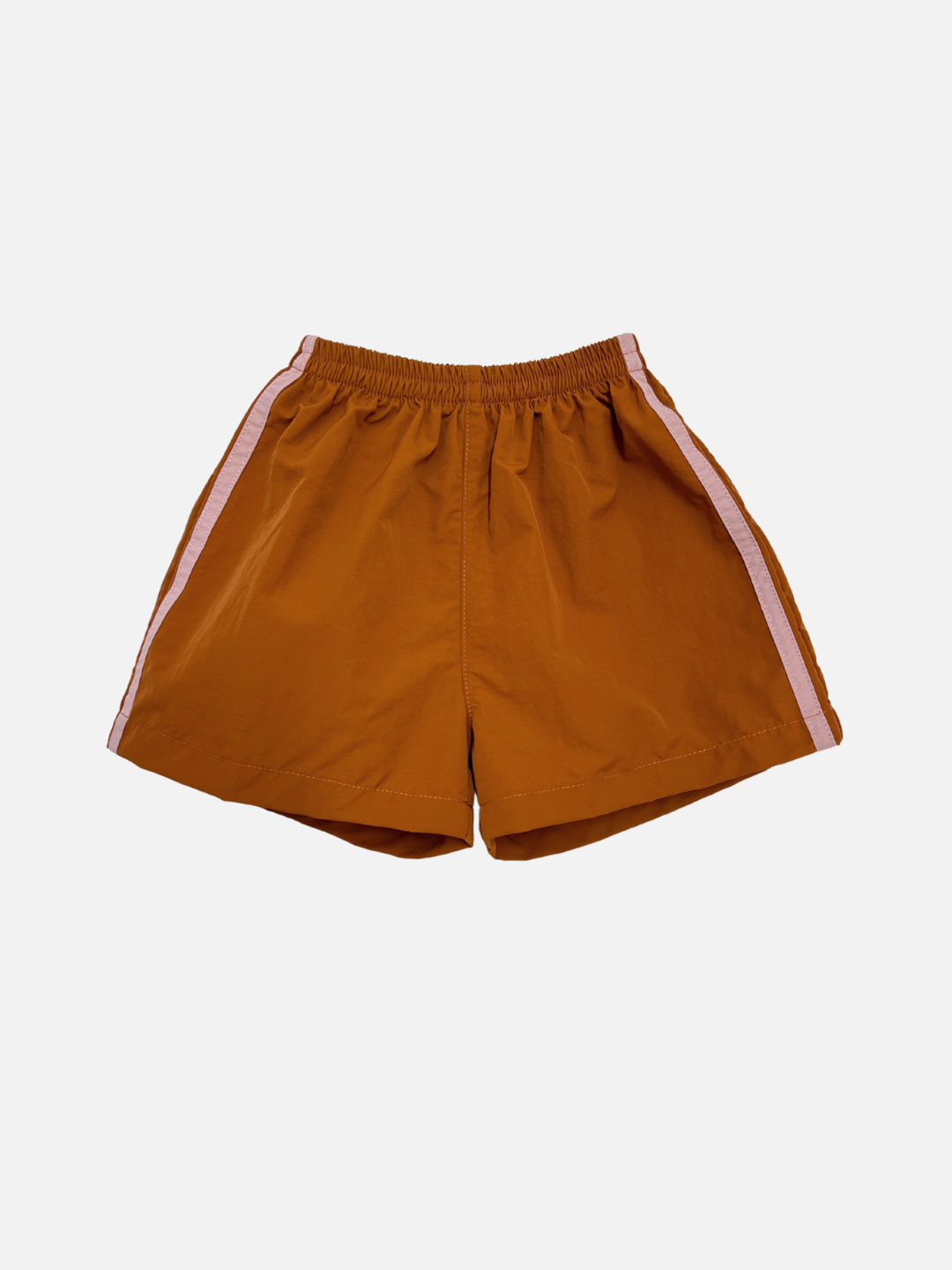 SPRINTER SHORTS in rust with an elasticated waist and light pink side stripes, made from performance fabric, displayed flat on a white background.