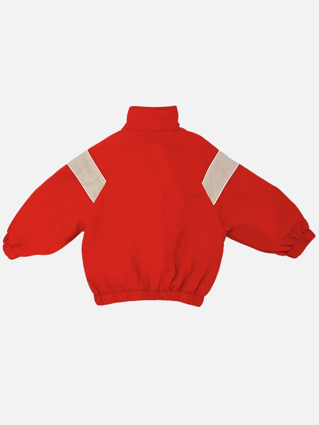 Red | The WARM-UP JACKET, a red puffer jacket with a high collar, elastic cuffs, and white diagonal stripes on the shoulders from a Korean label, makes an excellent lightweight layer.