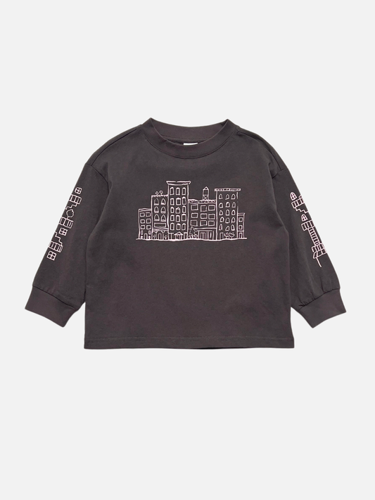 Image of Charcoal | Charcoal CITY LONGSLEEVE crafted from soft cotton jersey, featuring striking white city block graphics of buildings on the front and both sleeves, shown on a plain white background.