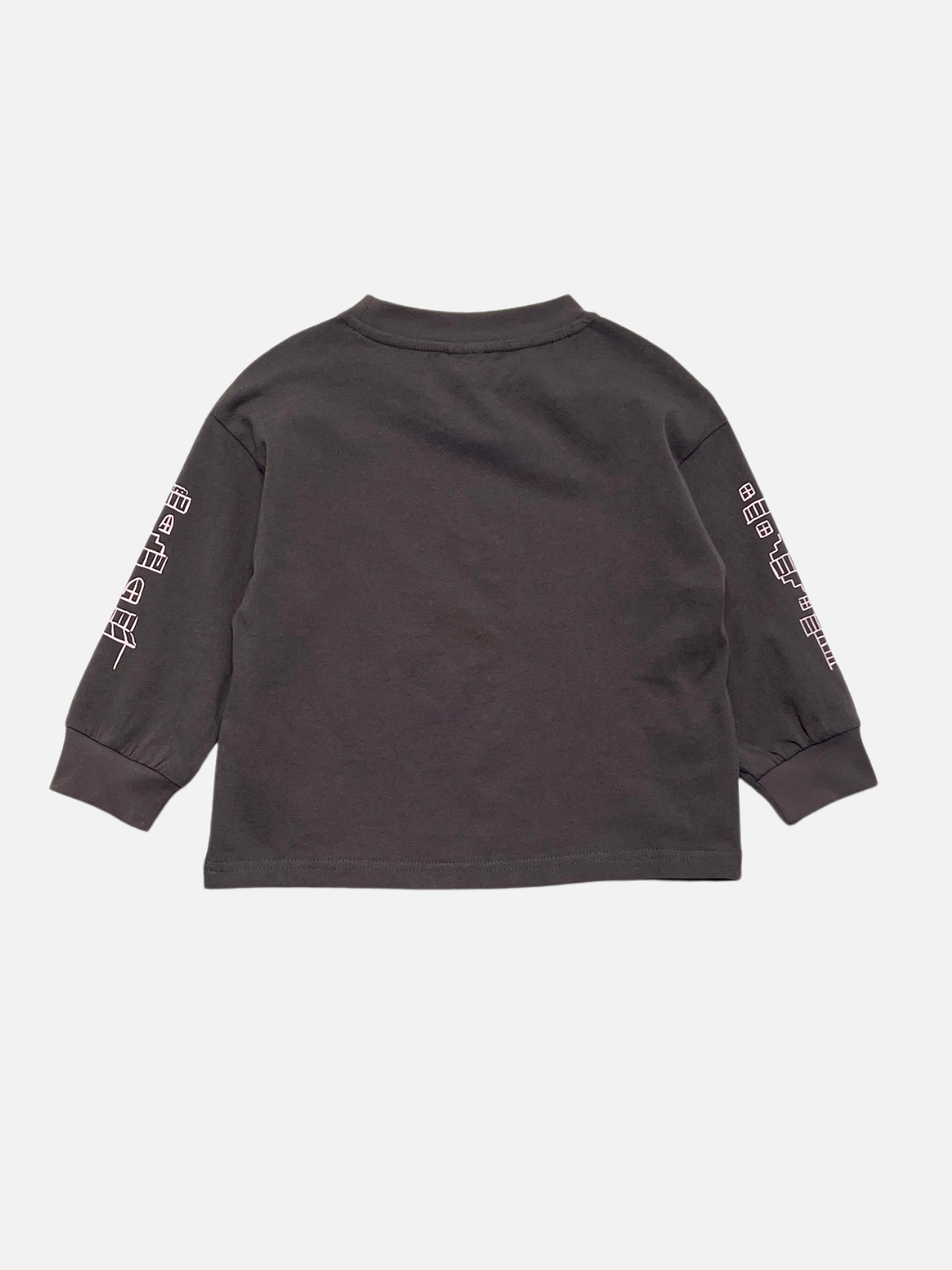 The CITY LONGSLEEVE is a relaxed-fit, black long sleeve tee shown from the back, featuring white geometric city block graphics along both sleeves. It is crafted from soft cotton jersey for comfort and style.