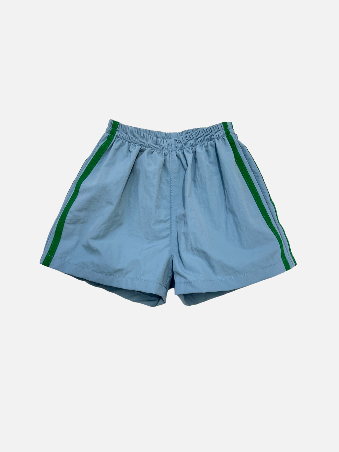 The SPRINTER SHORTS in blue feature an elastic waistband, green side stripes, and performance fabric, shown against a plain white background.
