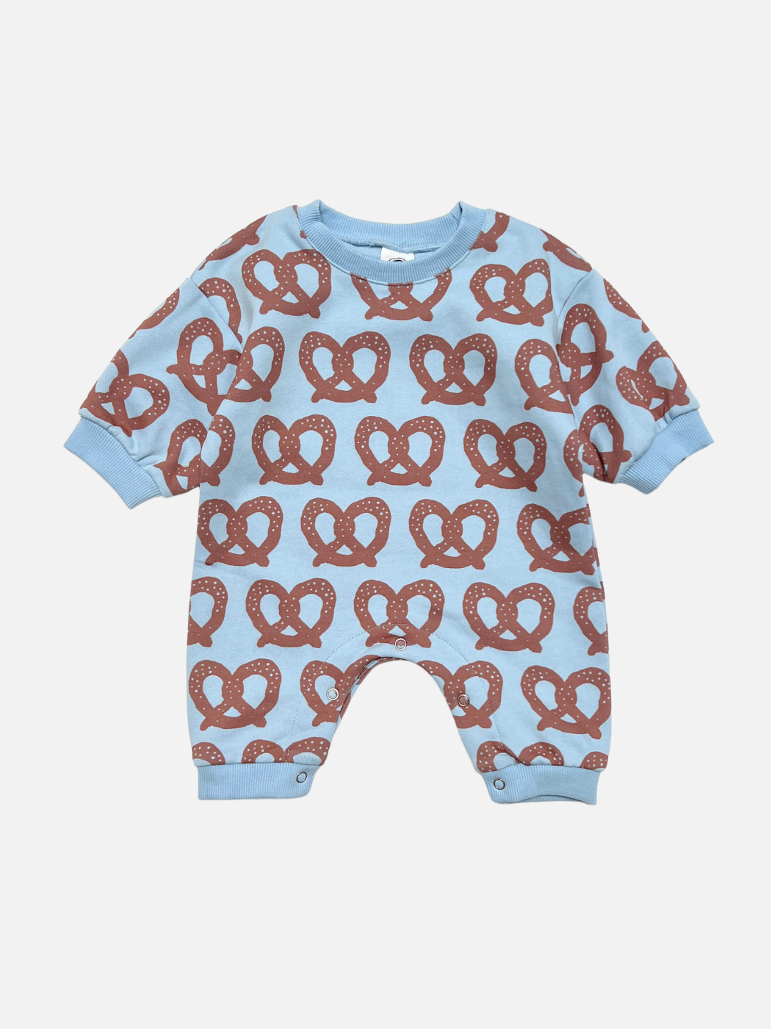 Brown/Blue | A baby long-sleeve footless romper in light blue, featuring an all-over repeating print of brown pretzels, shown against a light gray background.
