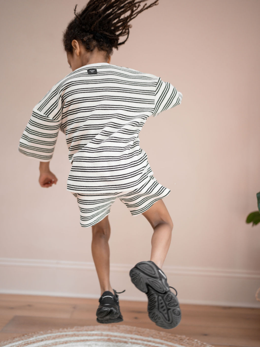 Stripe | A child is wearing stripe towel tee & shorts