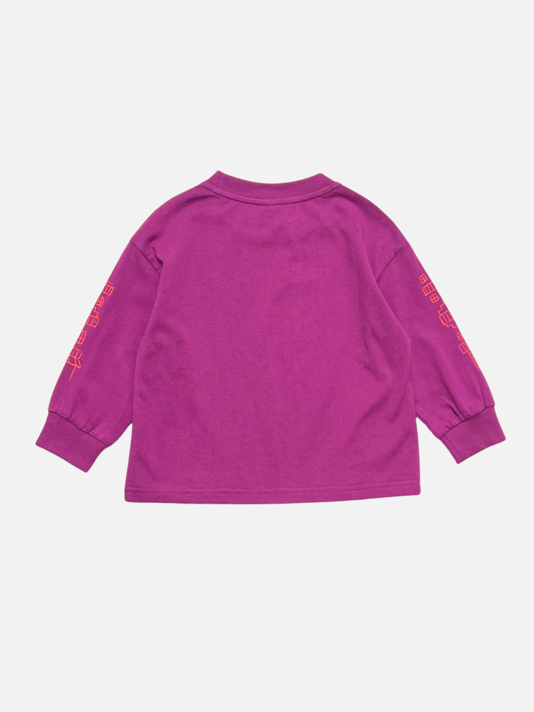 Magenta | The CITY LONGSLEEVE is a relaxed-fit, purple cotton jersey tee with bold orange city block graphics on both sleeves, displayed from the back against a plain white background.