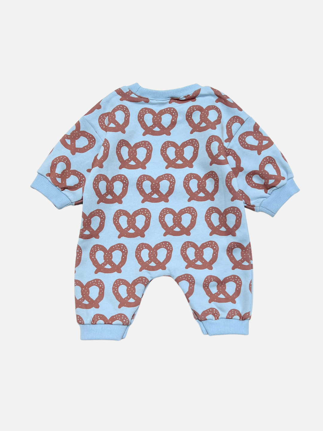 Brown/Blue | Back view of baby long-sleeve romper in light blue with an all-over brown pretzel pattern, shown flat against a light gray background.