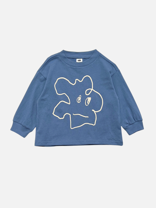 Image of Blue | The SQUIGGLE LONGSLEEVE is a blue relaxed-fit longsleeve tee crafted from 100% cotton, featuring a simple white abstract outline graphic of a face on the front, reminiscent of a doodle character, and displayed against a plain background.