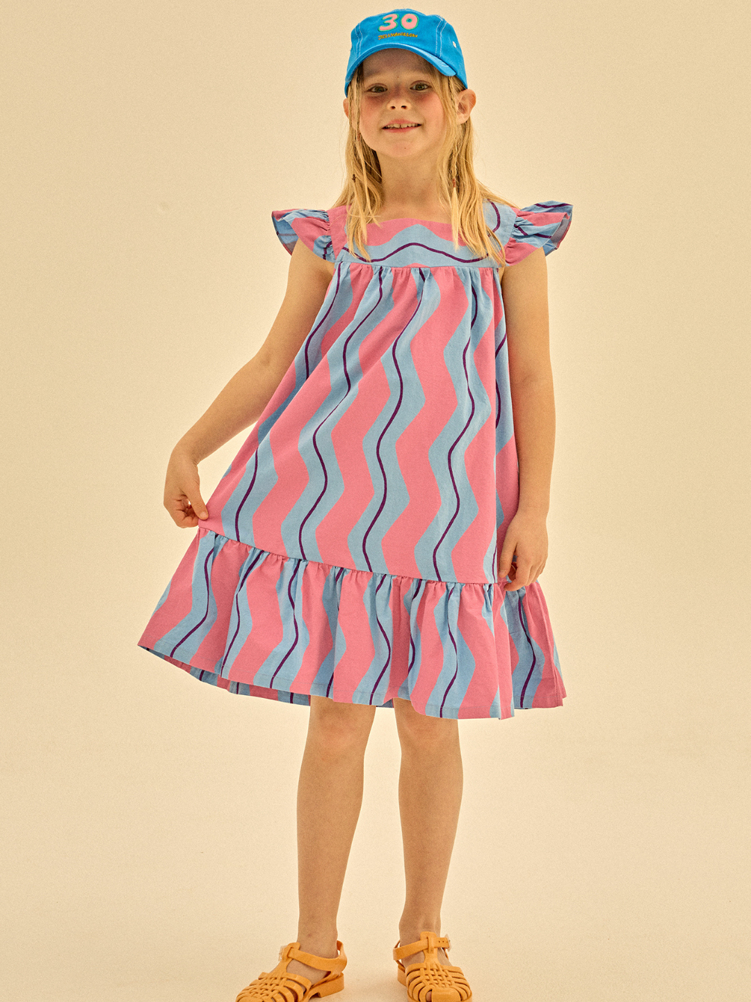 Child wearing Wave Stripe Dress.