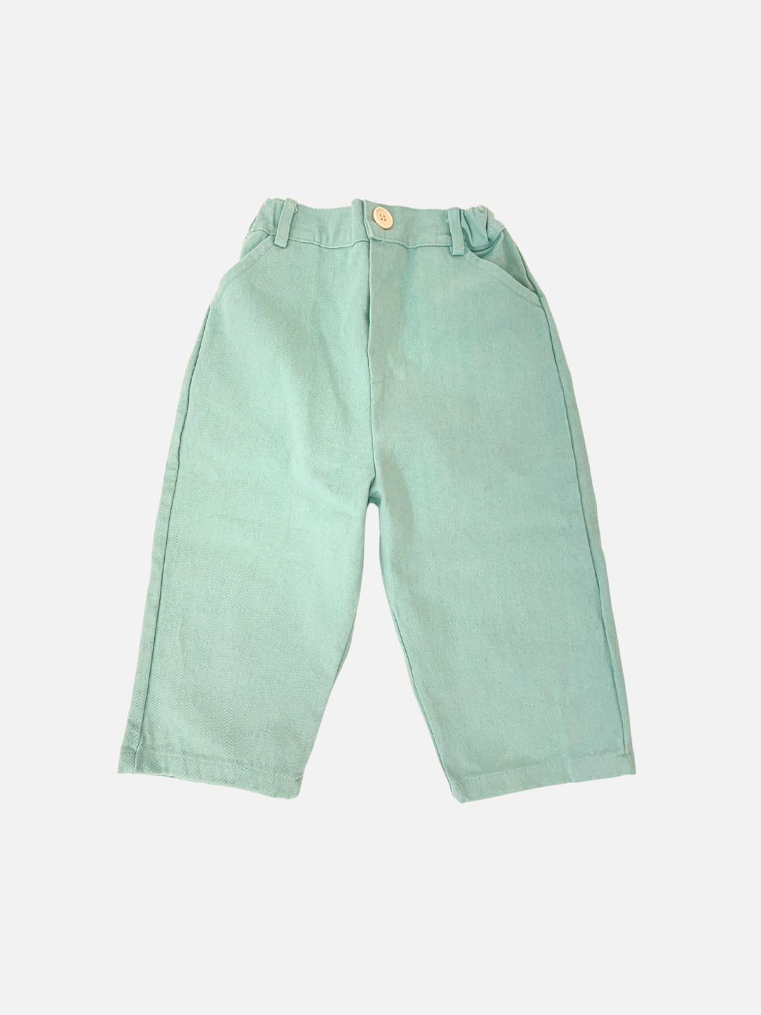 Mint | The renowned Korean children's brand offers Tomboy Pants in mint, made from soft cotton twill with an elastic waistband and a yellow front button, displayed on a white background.