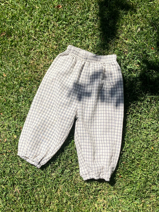 Second image of Front view of the kids' Grid Check Pull on Pant. Cream fabric with light black grid print.
