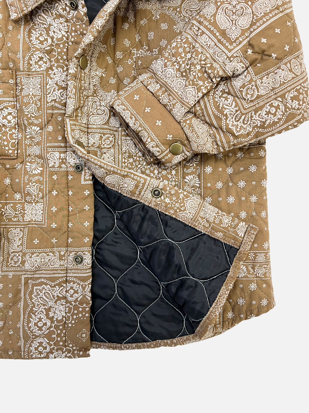 Close up on the kid's Bandana Quilted Overshirt highlighting the polyester lining